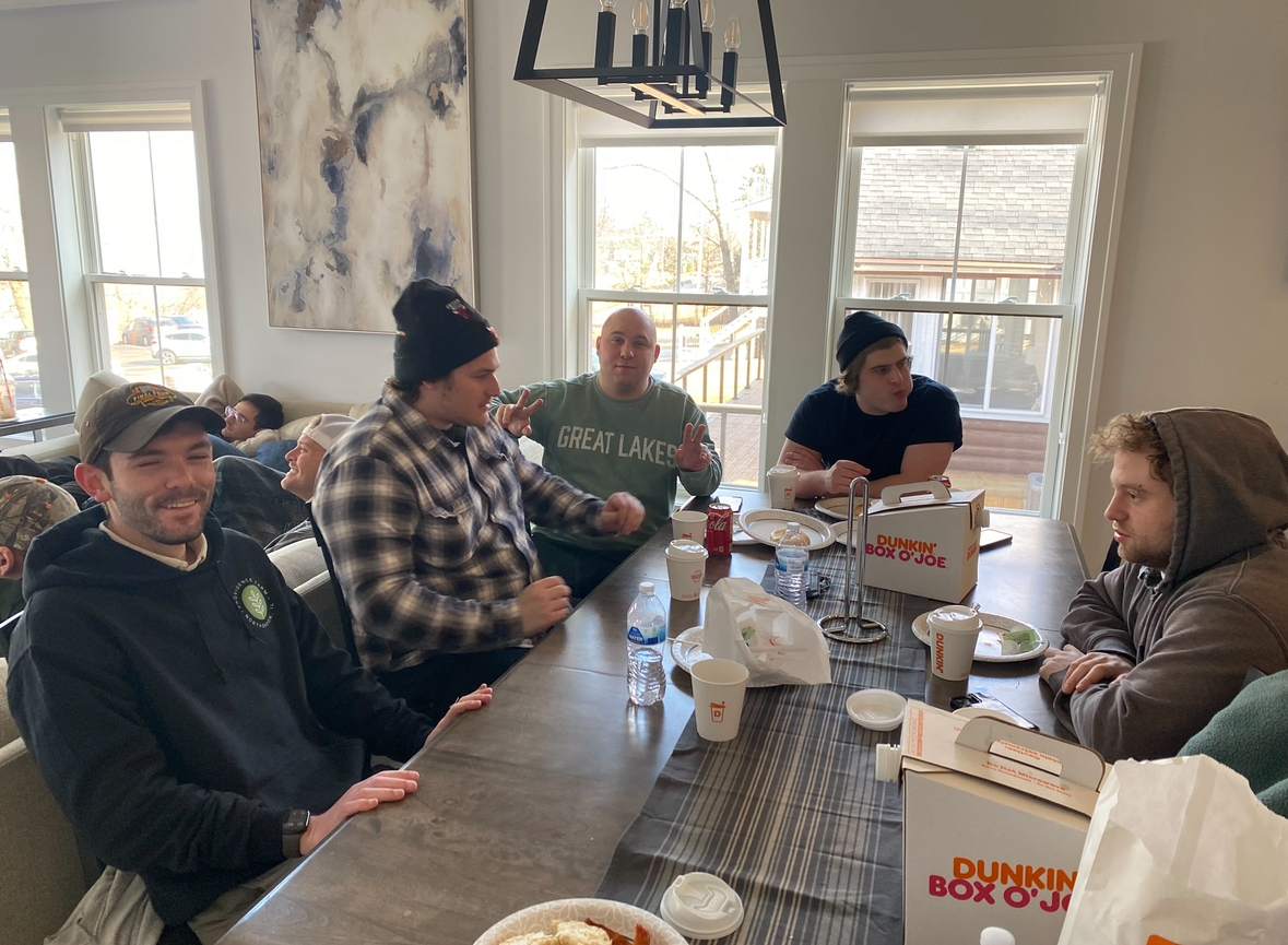 Providence Farm families sharing a meal together at the table
