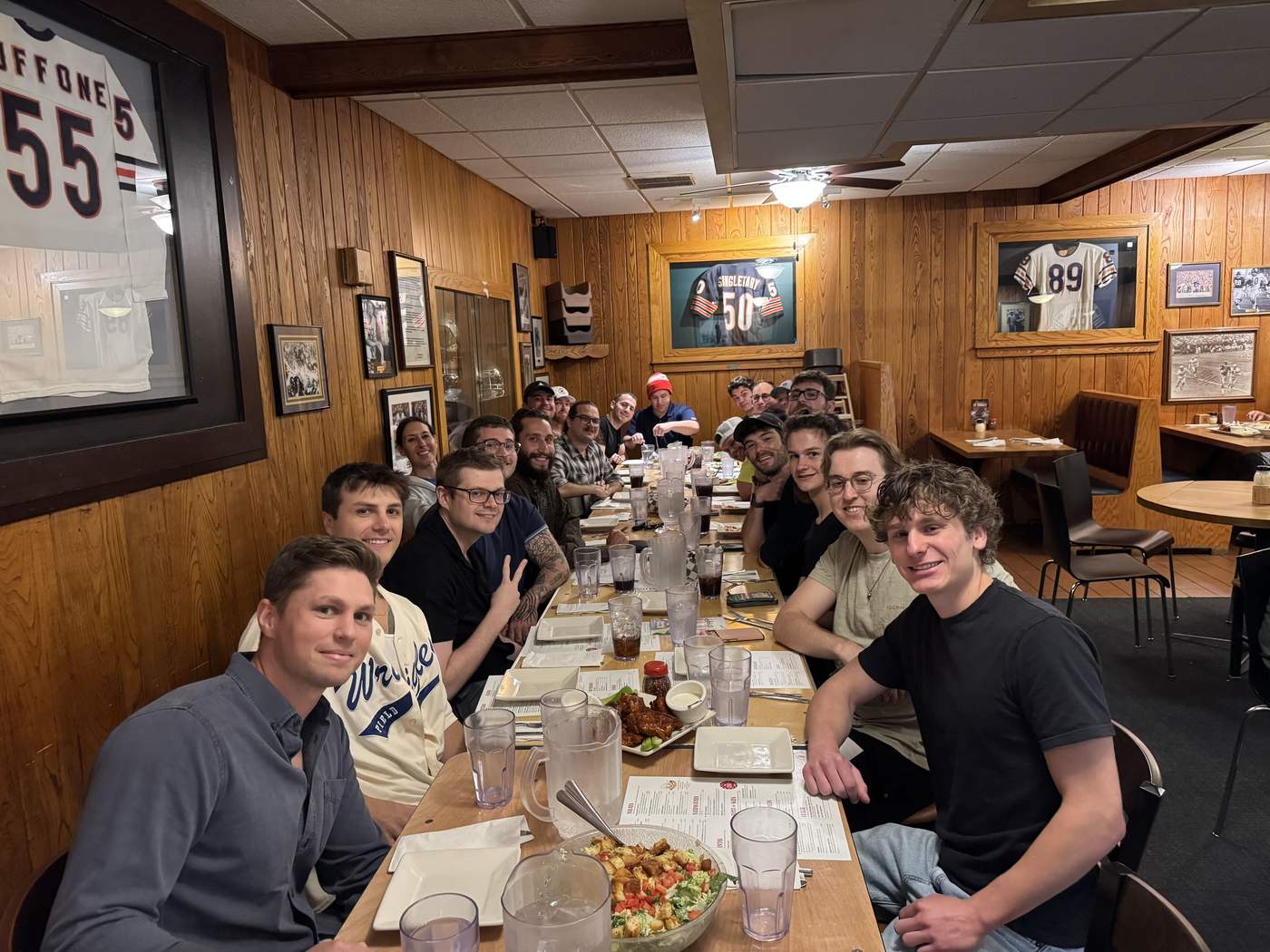Providence Farm alumni sharing a dinner at a long table