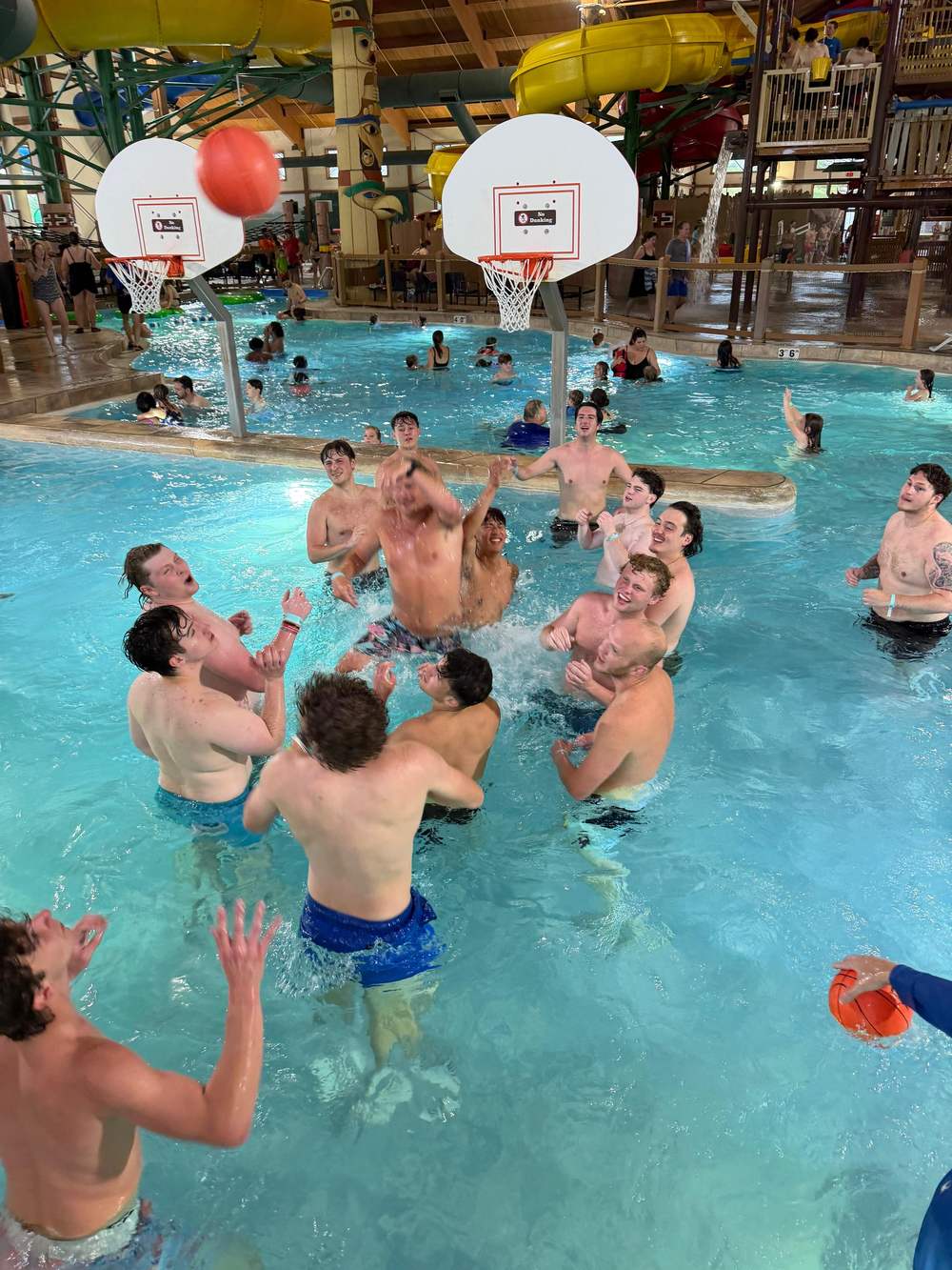 Providence Farm residents playing water basketball at a waterpark