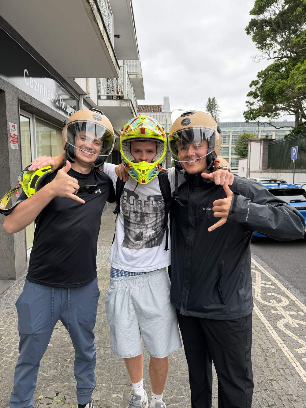 Three Providence Farm residents in helmets before a ride