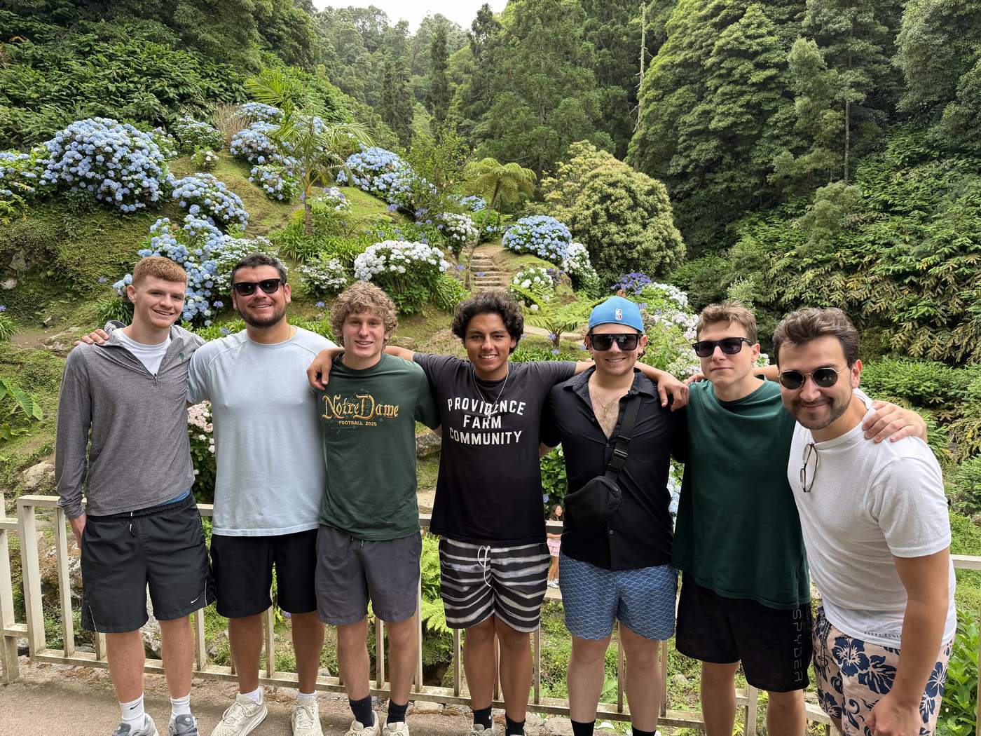 Providence Farm alumni together in a hydrangea garden